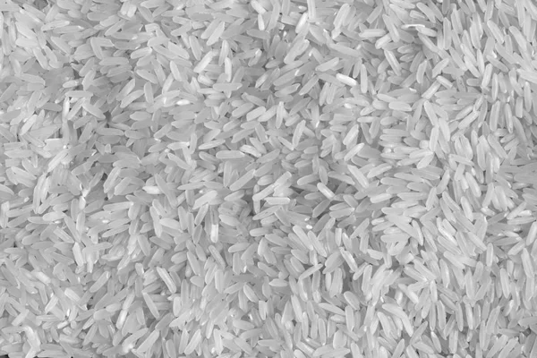 Pile of rice in black and white. Food and ingredientes background.