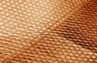 Turuncu renkli parlak metal yüzey. Arka plan ve tasarım için doku.