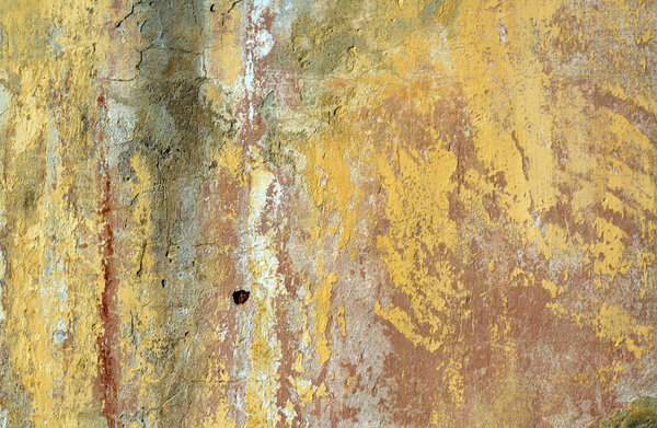 Yellow color grungy cement wall texture. Abstract architectural background and texture for design.