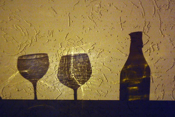 wine bottle and two glasses shadow. Abstract backround and view