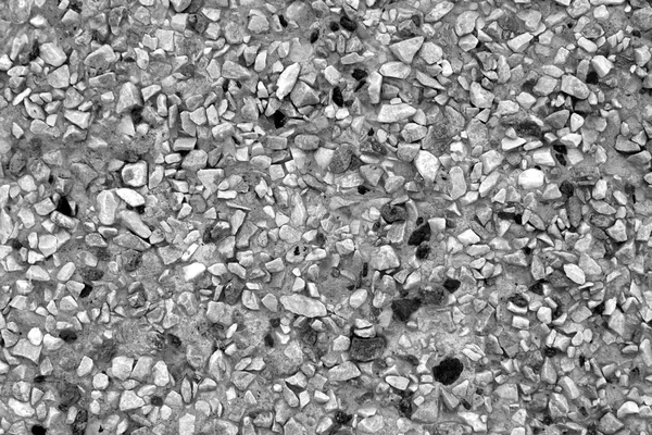 Pile of small gravel stones in black and white. Pile of small gravel stones. Seasonal natural background.