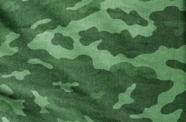 Eski Kamuflaj kumaş yeşil tonda. Arka plan ve tasarım ve fikirler için doku.