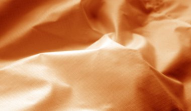 Turuncu renkli buruşuk şeffaf plastik yüzey. Arka plan ve tasarım için doku.