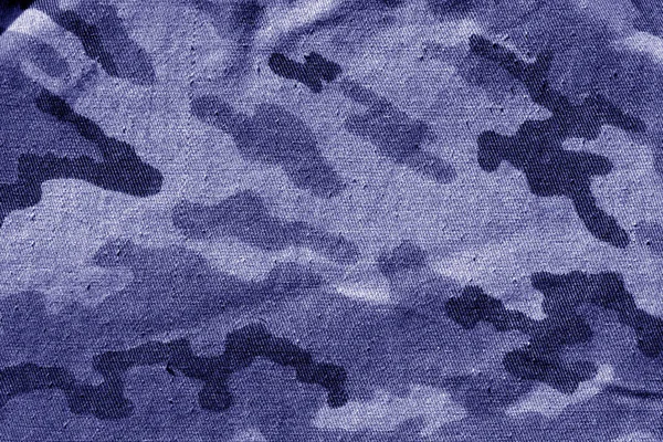 Dirty camouflage cloth in blue tone. Abstract background and texture for design abd ideas.
