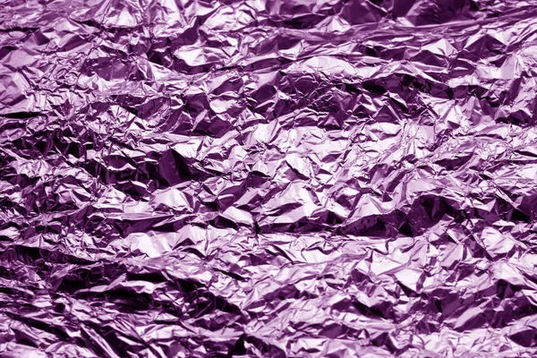 Metal foil texture in purple tone. Abstract background and texture for design.