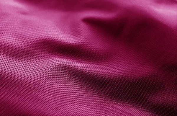 Textile texture with blur effect in pink color. Abstract background and texture for design.