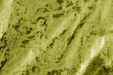 Islak plastik şeffaf eski doku sarı tonda sarın. Arka plan ve tasarım için doku.