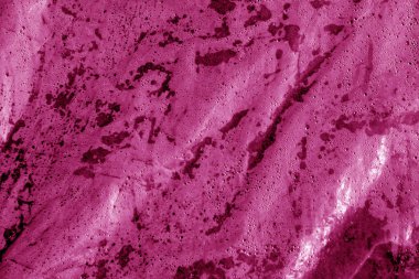 Islak plastik şeffaf eski doku pembe tonda sarın. Arka plan ve tasarım için doku.