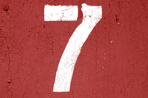 Number 7 in stencil on metal wall in red tone. — Stock Photo, Image