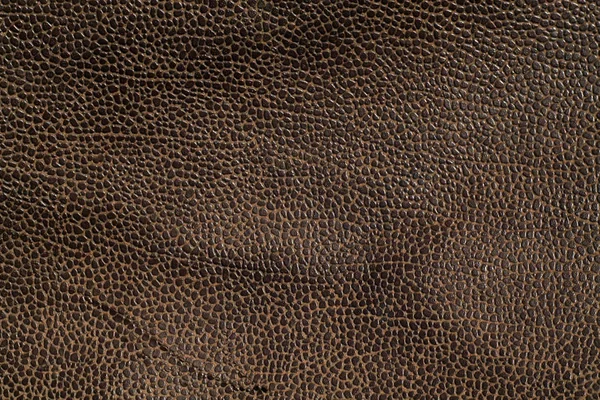 Kahverengi tonda yıpranmış deri doku.