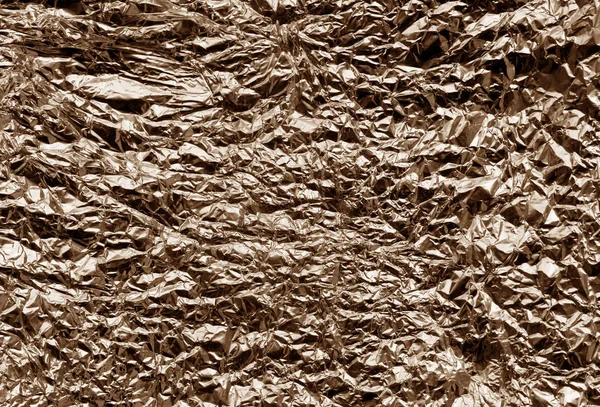Metal foil texture in brown color.