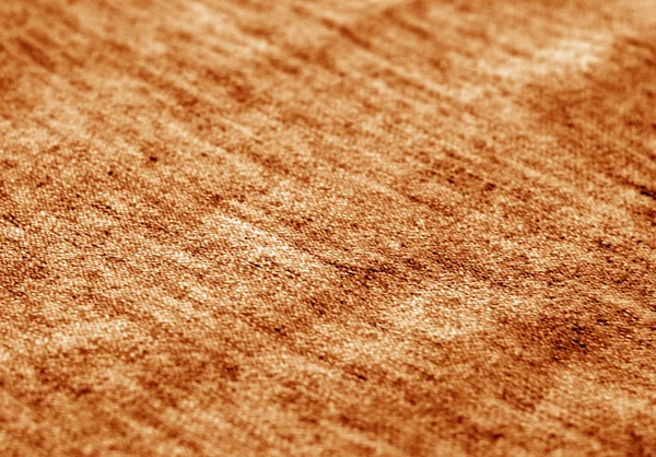 Textile Textur mit Unschärfeeffekt in Orangetönen. — Stockfoto