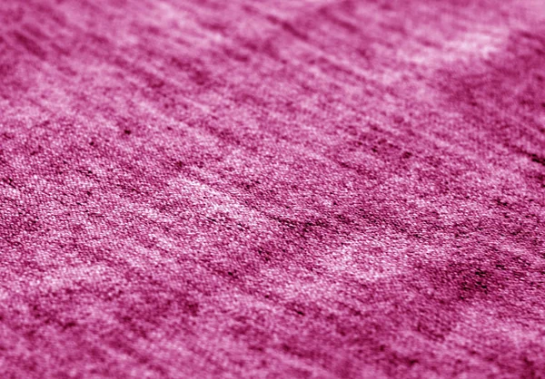 Pembe tonda bulanıklık etkisi olan tekstil dokusu. — Stok fotoğraf