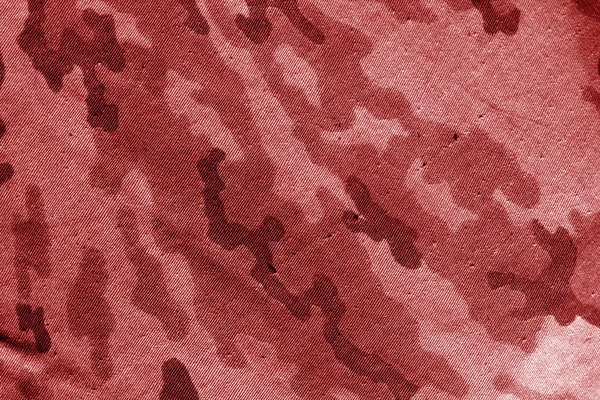 Dirty camouflage cloth in red tone.