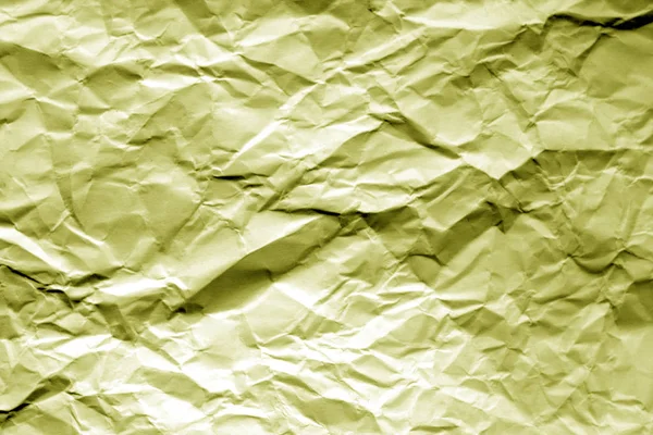 Crumpled sheet of paper in yellow color. — Stock Photo, Image