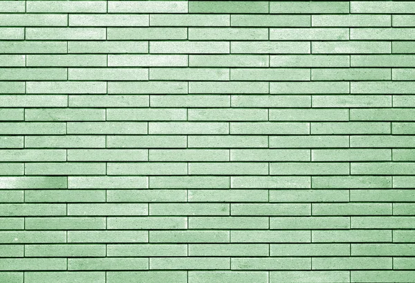 Декоративная кирпичная стена в зеленом тоне . — стоковое фото