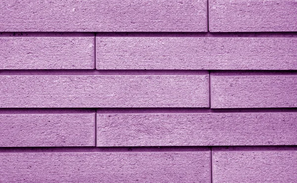 Decorative brick wall in purple color. — Stock Photo, Image