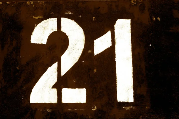 Number 21 in stencil on metal wall in brown tone. — Stock Photo, Image