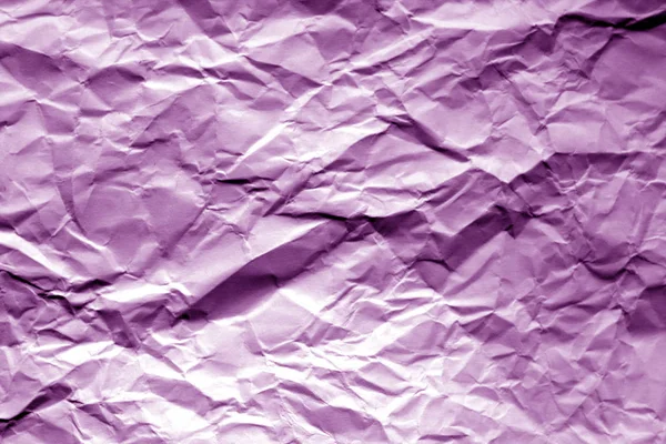 Crumpled sheet of paper in purple color. — Stock Photo, Image