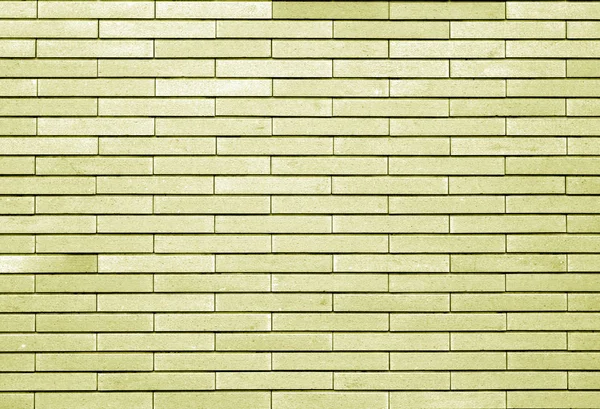 Ozdobnou cihlovou zeď v žlutém tónu. — Stock fotografie