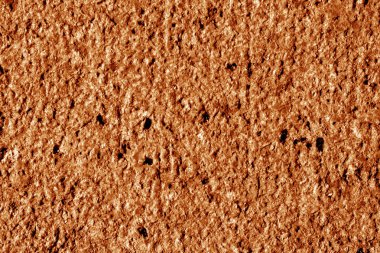 Granit yüzey arka planda turuncu ton olarak.