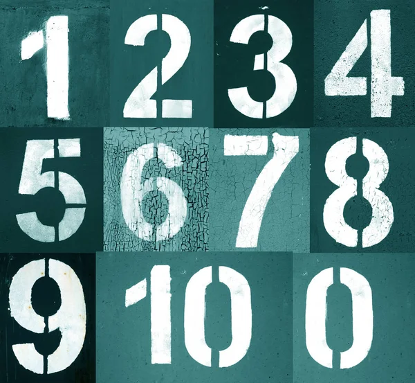 Numbers 0 to 10 in stencil on metal wall in cyan tone.