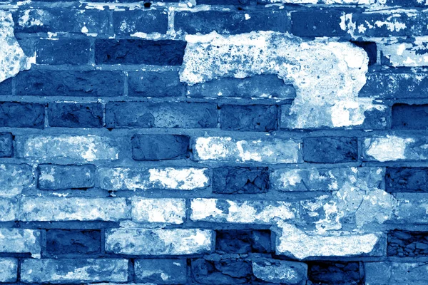 Old grungy brick wall surface in navy blue tone. — Stock Photo, Image