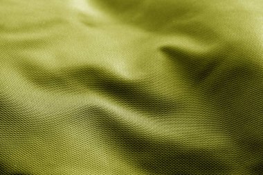 Sarı renkte çuval bezi dokusu.