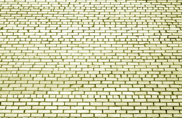 Modèle de mur de briques avec effet flou dans le ton jaune . — Photo