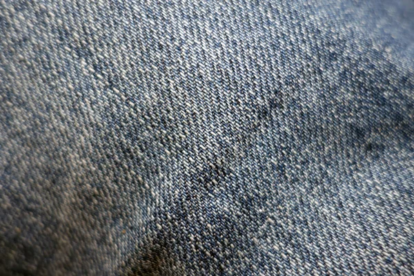 ぼかし効果を持つ青い色のジーンズの布パターン. — ストック写真