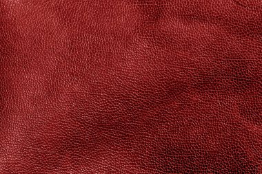 Kırmızı tonda yıpranmış deri doku.