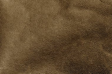 Kahverengi tonda yıpranmış deri doku.