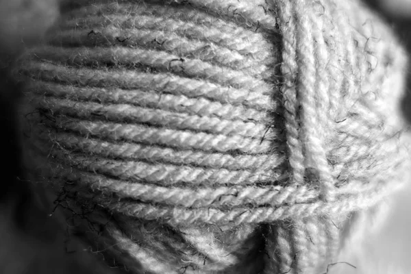 Yarn ball close-up with blur effect in black and white. — Stock Photo, Image