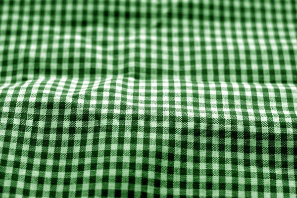 Проверка текстуры ткани в эффекте размытия зеленым тоном . — стоковое фото