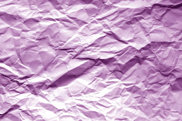 Crumpled sheet of paper with blur effect in purple tone. — Stock Photo, Image