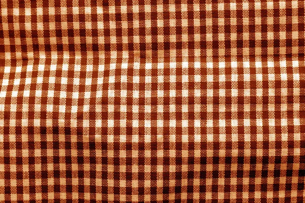Checked fabric texture in orange tone.