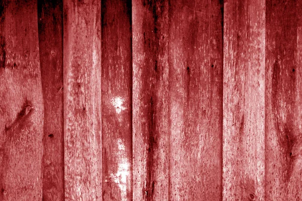 Viharzott fa kerítés piros színben. — Stock Fotó