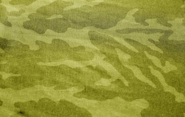 Sarı tonda bulanıklık etkisi olan kirli kamuflaj bezi.