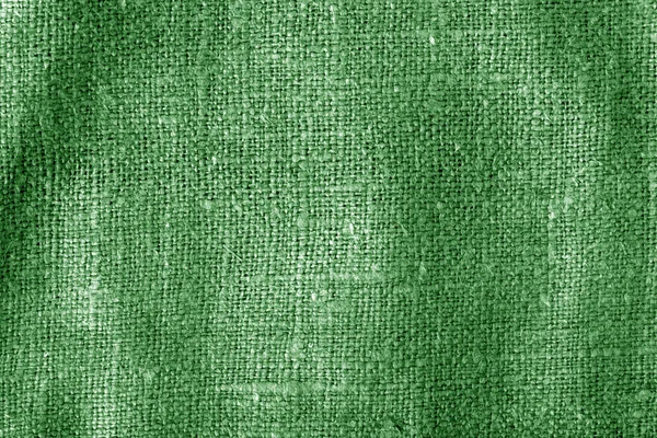 Textura de tela de saco con efecto difuminado en color verde . — Foto de Stock