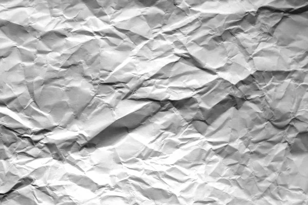 Crumpled sheet of paper with blur effect in black and white. — Stock Photo, Image