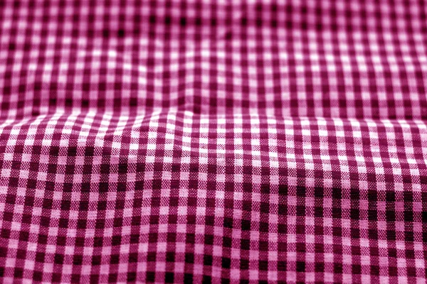 Textura de tecido verificada no efeito borrão em tom rosa . — Fotografia de Stock