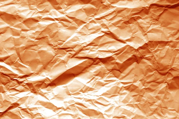 Folha de papel amassada com efeito borrão em tom laranja . — Fotografia de Stock