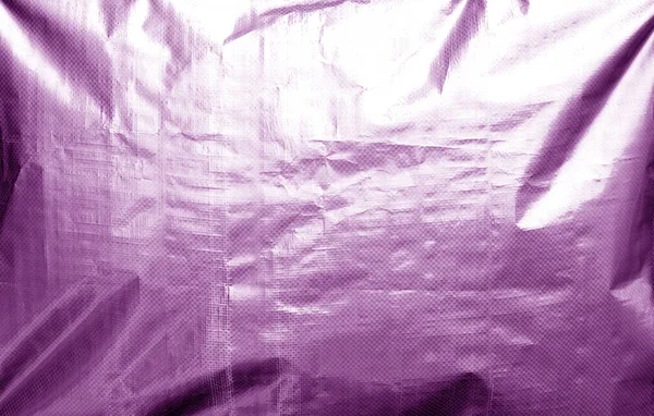 Металізована текстура пластикової обгортки з малинами фіолетового кольору . — стокове фото