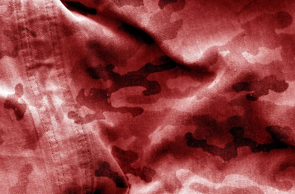 Dirty camouflage cloth with blur effect in red tone. — ストック写真