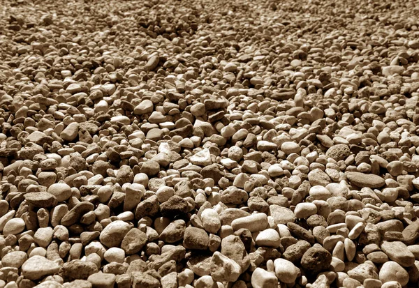 Σωρός από πέτρες μικρό χαλίκι στο καφέ τόνο. — Φωτογραφία Αρχείου