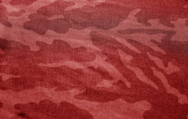 Dirty camouflage cloth with blur effect in red tone. — ストック写真