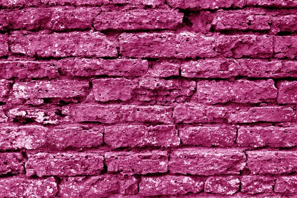 Textura de pared de ladrillo grueso viejo en tono rosa . —  Fotos de Stock