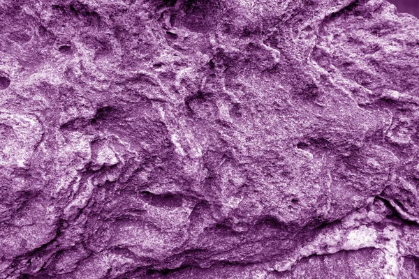 Old stone surface in purple tone. — ストック写真