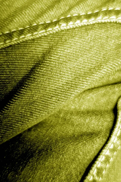 Jeans on leg close-up in yellow color. — Stock Photo, Image