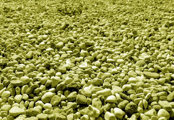 Pile małych kamieni żwirowych w kolorze żółtym. — Zdjęcie stockowe